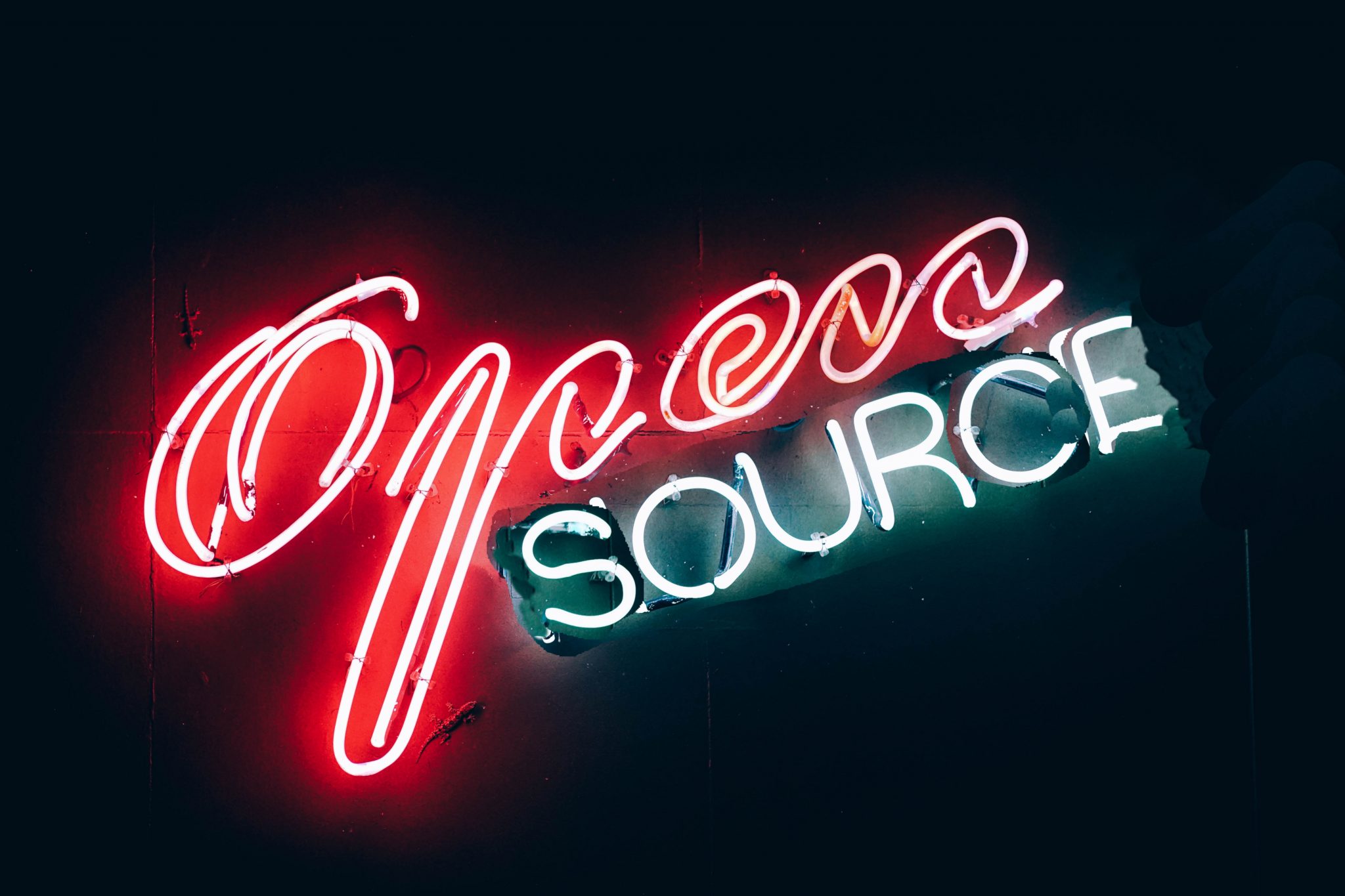 Photo of Neon sign spelling "Open Source"